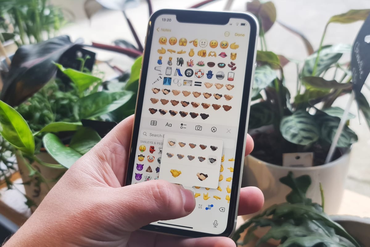 What new emojis are available on Apple's iOS 15.4?